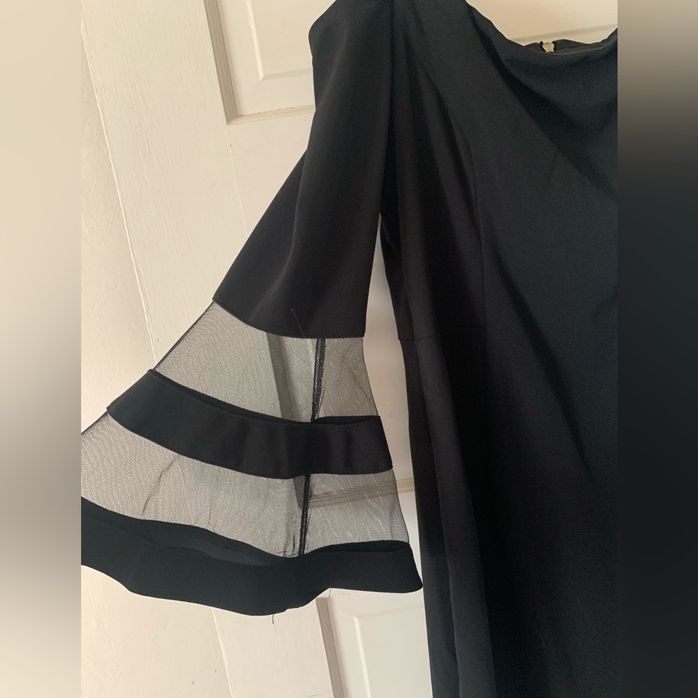 Off the shoulder black dress with bell sleeves